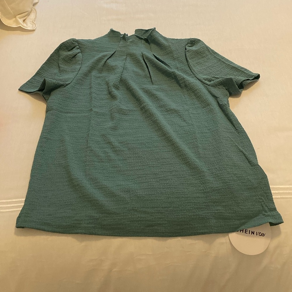 Green ruffle neck shirt